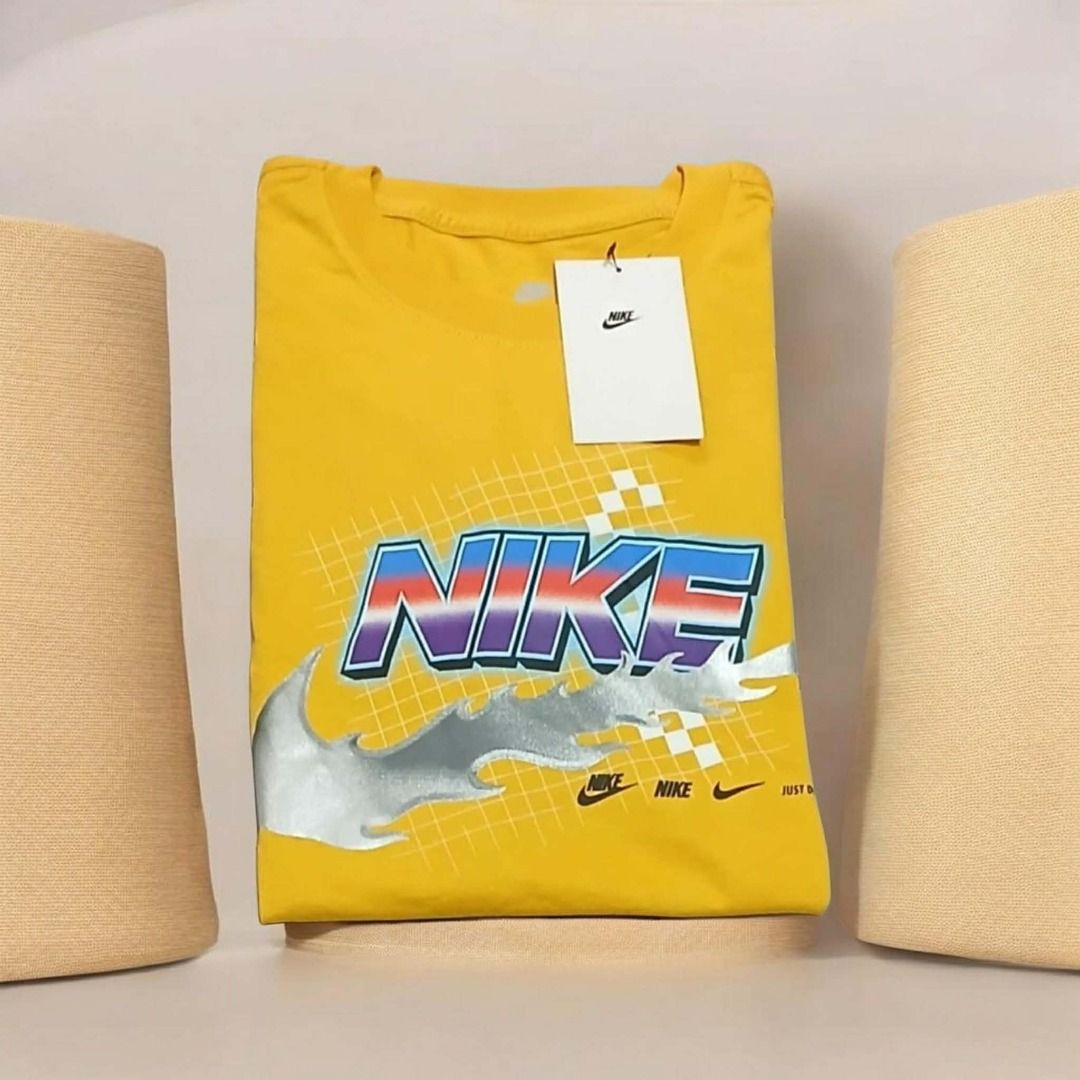 Nike Racing Tee Size- M (Category: Tshirts & Polo Shirts ) located in Balagtas. Submitted by janlex (Listing ID 1460331955, Image 1). Description: - Yellow Nike T-Shirt - Features a cool retro graphic print - Classic Nike logo - Ideal for casual wear - Brand new with tags attached.