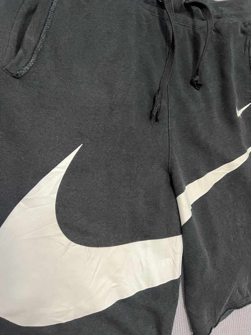 Nike swoosh shorts (Category: Shorts) located in Aparri. Submitted by amnorthloots (Listing ID 1460422552, Image 3). Description: Excellent Print logo 10/10 (no cracks. No hairlines) Color rate black (8.8/10) No issue Dimes Waistline 32”-40” Length 21”.