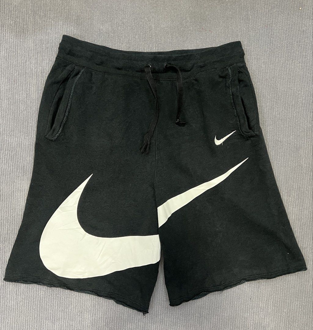 Nike swoosh shorts (Category: Shorts) located in Aparri. Submitted by amnorthloots (Listing ID 1460422552, Image 1). Description: Excellent Print logo 10/10 (no cracks. No hairlines) Color rate black (8.8/10) No issue Dimes Waistline 32”-40” Length 21”.