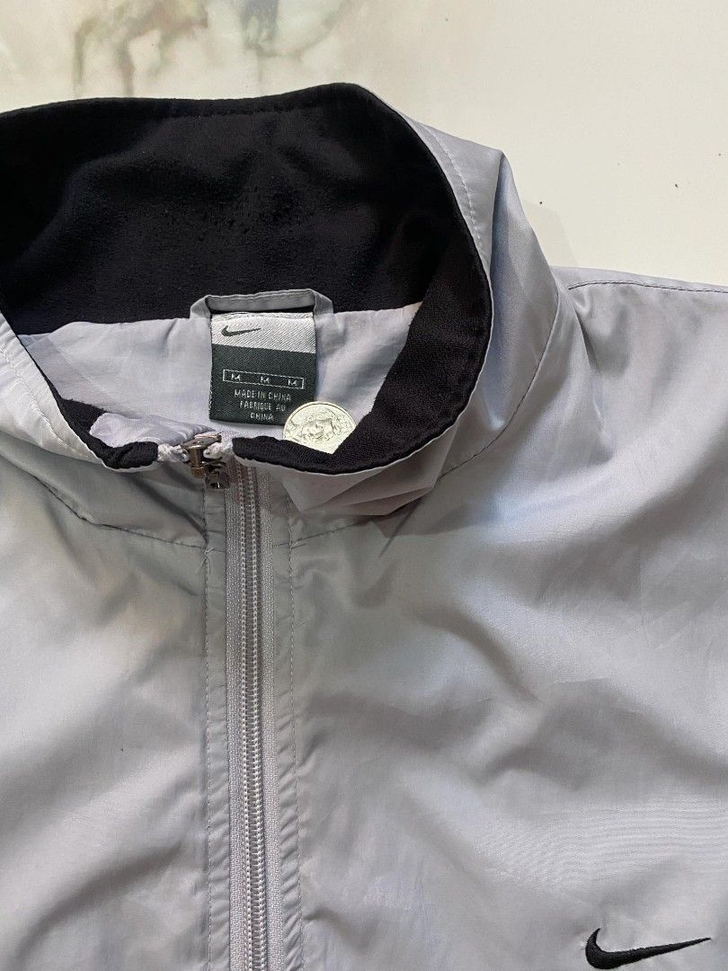 Nike Windbreaker (Category: Activewear) located in Tayug. Submitted by thriftppings (Listing ID 1460343514, Image 3). Description: - Nike Lightweight Windbreaker - Condition: 9/10 - Color: 9/10 - Drawstring hem - Minor issue on last pic - Dimes: W24 x L27.