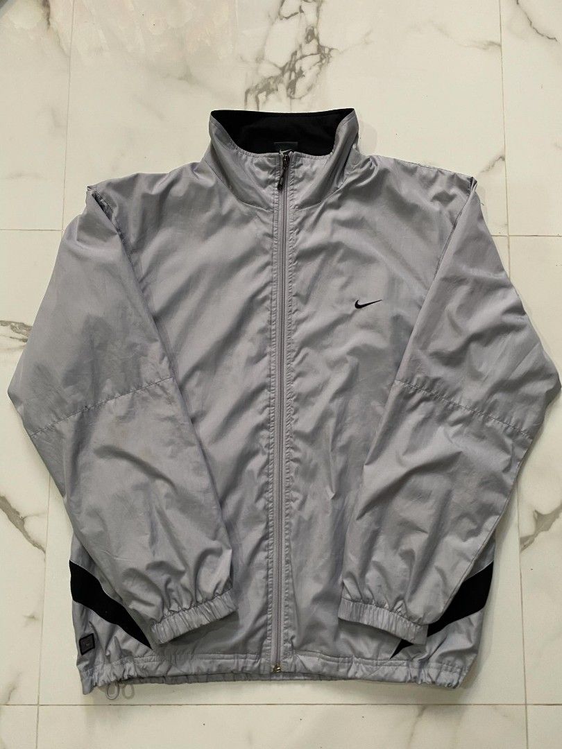 Nike Windbreaker (Category: Activewear) located in Tayug. Submitted by thriftppings (Listing ID 1460343514, Image 1). Description: - Nike Lightweight Windbreaker - Condition: 9/10 - Color: 9/10 - Drawstring hem - Minor issue on last pic - Dimes: W24 x L27.