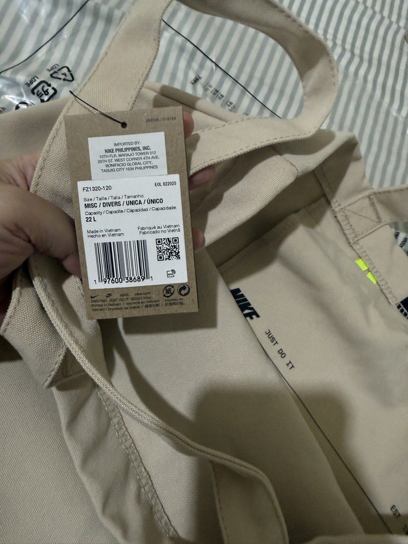Nike x BTS Collaboration Tote Bag (Category: Tote Bags) located in Makati City. Submitted by beshbuy (Listing ID 1460443639, Image 2). Description: Authentic Nike x BTS canvas tote bag in beige. Features BTS logo and Nike Swoosh. "Nike Just Do It" inside. Size 22L. Made in Vietnam. Bought in BGC.