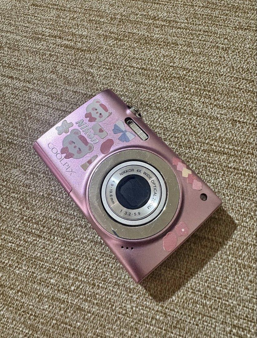 Nikon Coolpix Pink Digital Camera (Category: Cameras) located in Marikina City. Submitted by chieana_pineda (Listing ID 1460424208, Image 1). Description: zoom: NIKKOR 4x optical zoom - megapixels: 12.0 Mp - lcd: 2.7-inch - flash: working, with long-press red light - lens: no delay - tested - all buttons work effectively, need lang i press hard at times Issues: - no strap holder - signs of use - has lcd burn but doesn’t affect output - blue faint