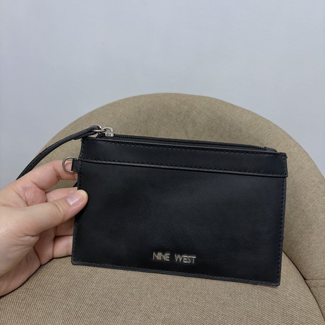 Nine west black wrislet wallet (Category: Purses & Pouches) located in San Carlos. Submitted by marj.mco (Listing ID 1460437657, Image 1). Description: US bought Preloved 100% original.