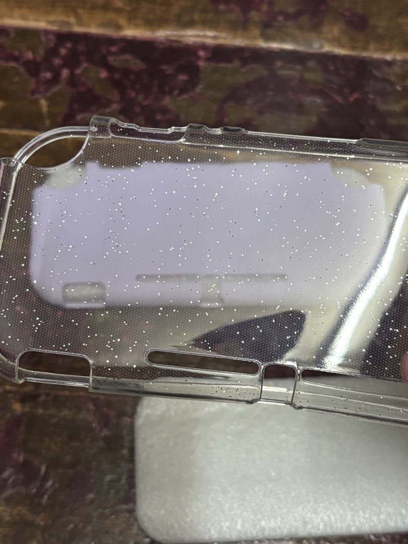Nintendo Switch Lite Back Case BUNDLE (Category: Cases & Covers) located in Makati City. Submitted by dharma444 (Listing ID 1460420388, Image 3). Description: Rfs: Decluttering Bundle Never used - Purple (1) -Transparent Glitter (1) MOD - Lalamove only. Delivery fee will be shouldered by the buyer. MOP - GCash ONLY..