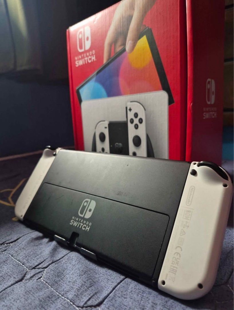 Nintendo Switch OLED (Category: Nintendo) located in Makati City. Submitted by stuhxoo (Listing ID 1460464143, Image 2). Description: Nintendo Switch OLED White Switch #2 Inclusions: - Box - Screen Protector - Dobe Joy-Con Grip (White) - Joy-Con Grip - Dock - HDMI Cable - Charger - Joycon Straps .