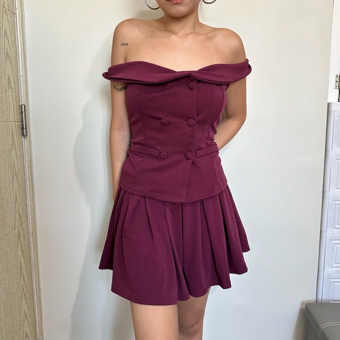 Off-Shoulder Blazer Top with Pleated Skirt (Category: Dresses) located in Pasay City. Submitted by nicoletlntn_ (Listing ID 1460479339, Image 1). Description: - Chic off-shoulder blazer blouse and skirt - Stunning burgundy color - Elegant double-breasted button detail - Flattering pleated skirt for added flair - Ideal for nights out or special events - Comfortable and well-fitting.