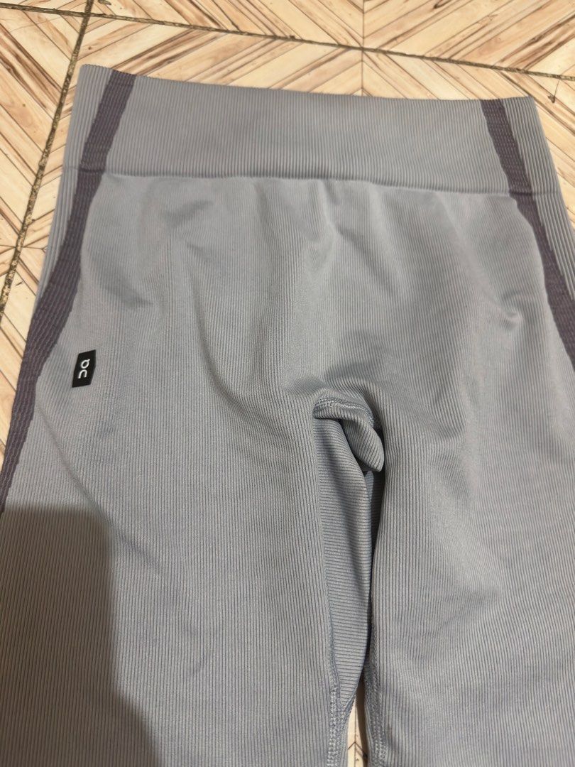 On Running Studio Knit Tights Women's Performance Training Grey (Category: Activewear) located in Manila. Submitted by jessj30 (Listing ID 1460420198, Image 2). Description: - Brand: On Running - Style: Seamless knit tights - Designed for: Performance training - Features: Ribbed texture, darker grey side stripe details, high-waisted fit - Versatile: Ideal for workouts or casual wear.