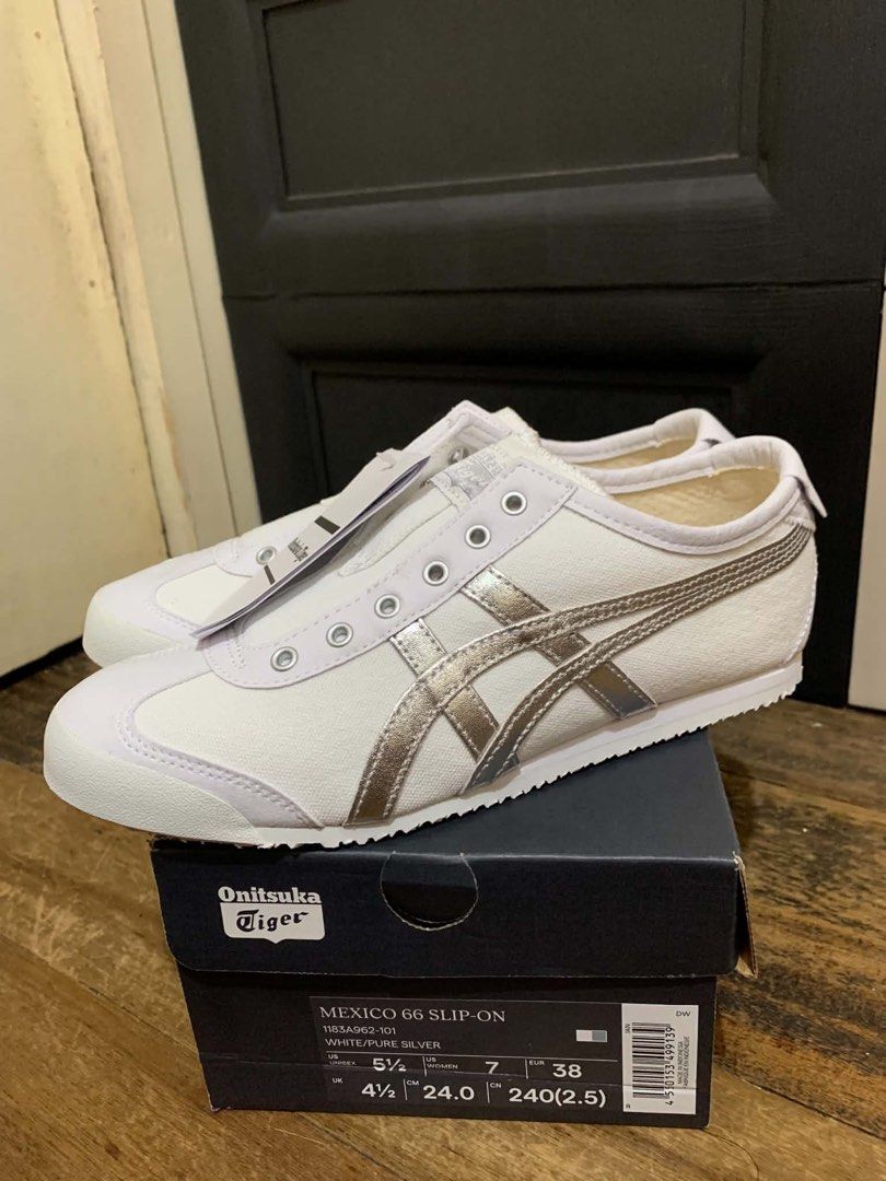 Onitsuka Tiger Mexico 66 Slip-On White Silver (Category: Sneakers) located in Pasig City. Submitted by emyzizzle (Listing ID 1460407176, Image 2). Description: - Onitsuka Tiger Mexico 66 Slip-On Bought in Japan, complete with box & paper bag - Color: White with Silver Stripes - Size: US Women's 7 (24cm) - Condition: Brand New with Tags and Original Box - Features: Easy slip-on design - Ideal for: Casual wear and everyday comfort.