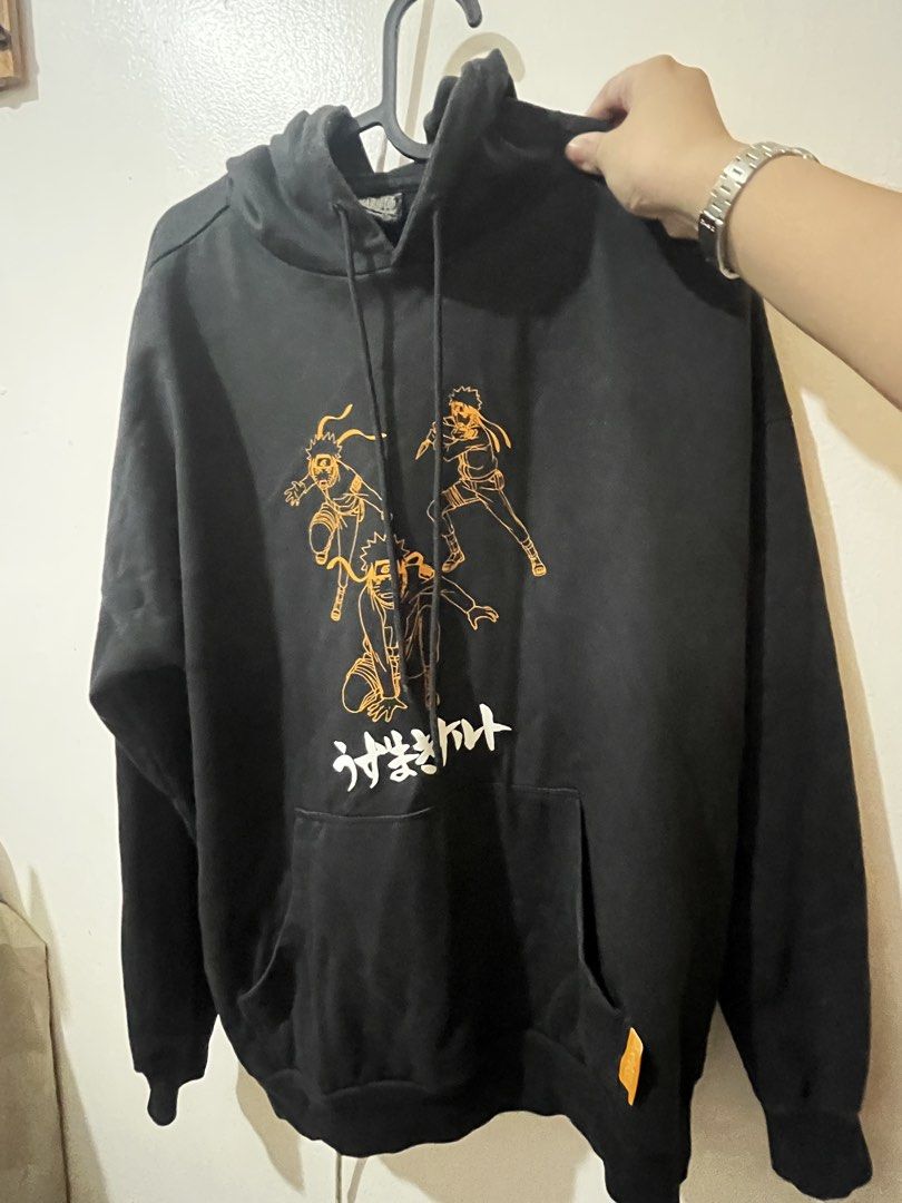 OXGN Black Naruto Graphic Hoodie | Anime Pullover (Category: Hoodies) located in Iloilo. Submitted by avenelle.co (Listing ID 1460436677, Image 1). Description: Black OXGN Naruto graphic hoodie featuring an orange anime character print with Japanese lettering. Pullover style with a front kangaroo pocket, drawstring hood, and ribbed cuffs/hem. Easy to pair with jeans, cargos, or shorts for a casual streetwear look. Condition: Good pre-loved condit