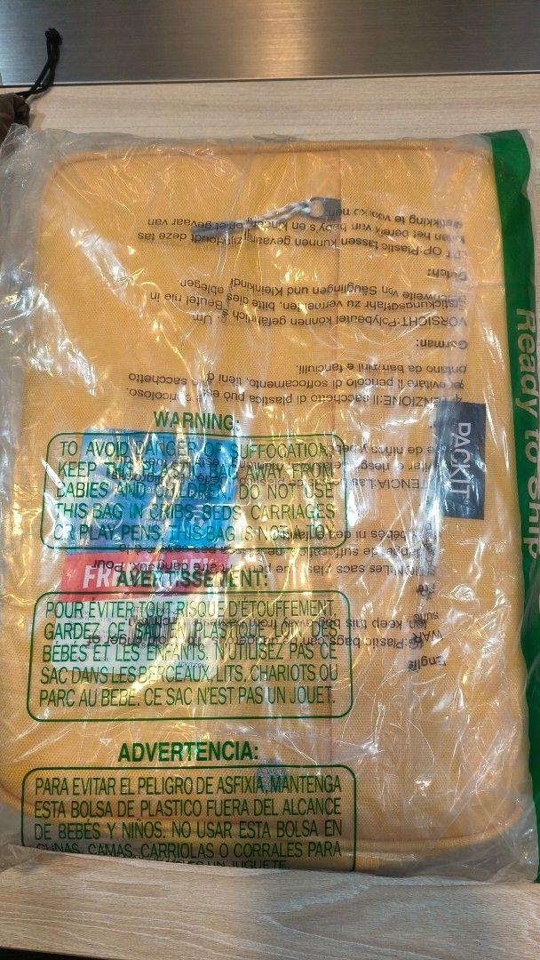 PackIt Yellow Storage Bag (Category: Storage Boxes & Baskets) located in Makati City. Submitted by fashion_thrift_ (Listing ID 1460430492, Image 1). Description: Yellow storage bag from Packit. Comes in original packaging. Has warning labels in multiple languages. Great for organizing or travel. Dimensions not specified. Please check photos for details..