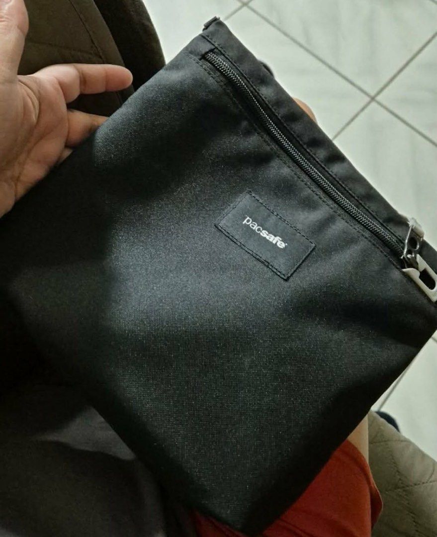 Pacsafe Black Crossbody Bag with Adjustable Strap (Category: Cross-body Bags) located in Manila. Submitted by ja3sonline2019 (Listing ID 1460447361, Image 3). Description: - Black Pacsafe crossbody bag - Main zippered compartment - Front zippered pocket - Adjustable and detachable strap - Made with durable material - Ideal for travel or everyday use - Clean and simple design.
