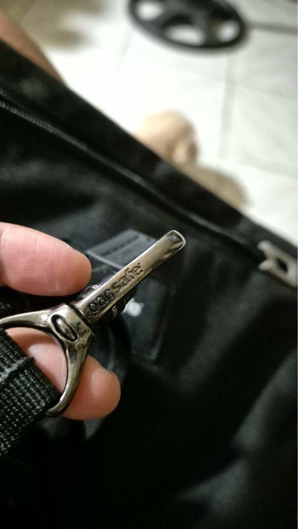 Pacsafe Black Crossbody Bag with Adjustable Strap (Category: Cross-body Bags) located in Manila. Submitted by ja3sonline2019 (Listing ID 1460447361, Image 2). Description: - Black Pacsafe crossbody bag - Main zippered compartment - Front zippered pocket - Adjustable and detachable strap - Made with durable material - Ideal for travel or everyday use - Clean and simple design.