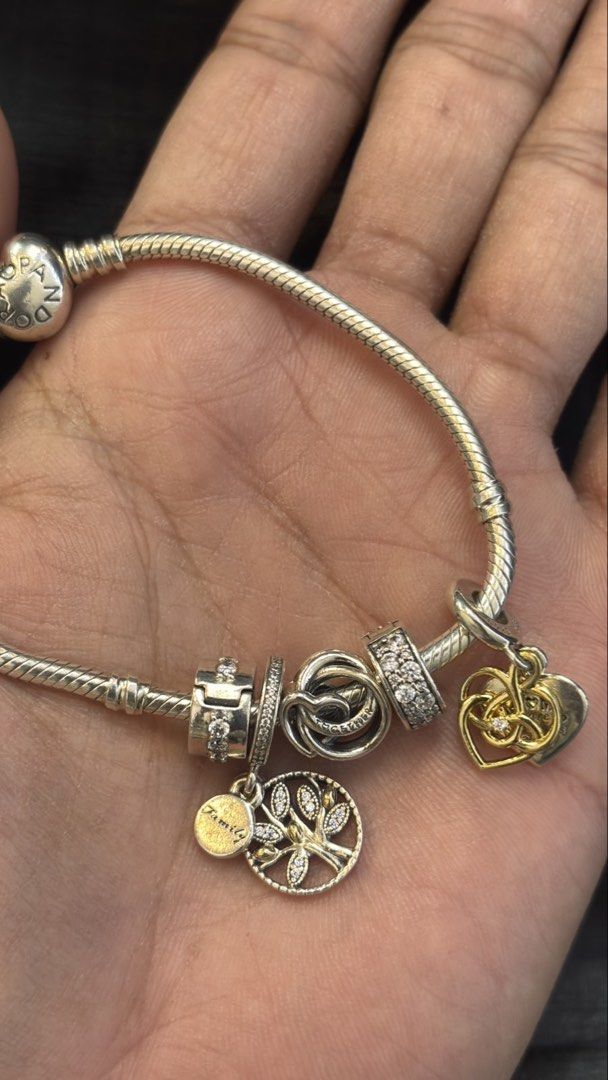Pandora Moments Bangle Set (Category: Luxury Accessories) located in Makati City. Submitted by as_luxe (Listing ID 1460342708, Image 1). Description: ✨ AUTHENTIC PANDORA MOMENTS BANGLE SET! ✨ Up for grabs is this elegant and meaningful PANDORA Moments Bangle curated with beautiful family, love, and growth themes featuring two-tone accents! 💖🌿💰 Our Price: ₱12,000.00 Product Details: • Material: 925 Sterling Silver, shimmering pavé cubic zirconi