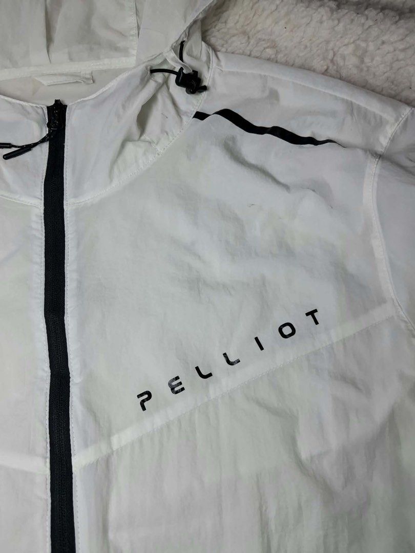 PELLIOT White Pocketable Hooded Jacket Large (Category: Activewear) located in Baguio. Submitted by padisellsz (Listing ID 1460413824, Image 3). Description: - White PELLIOT hooded jacket - Very good condition - Size: Large (fits 22x27.5 inches) - Material: 100% Nylon - Features: Pocketable design, lightweight, breathable with mesh panels, drawstring hood and hem, zipper closure - Ideal for: Travel, sports - Origin: Made in China - May washable s