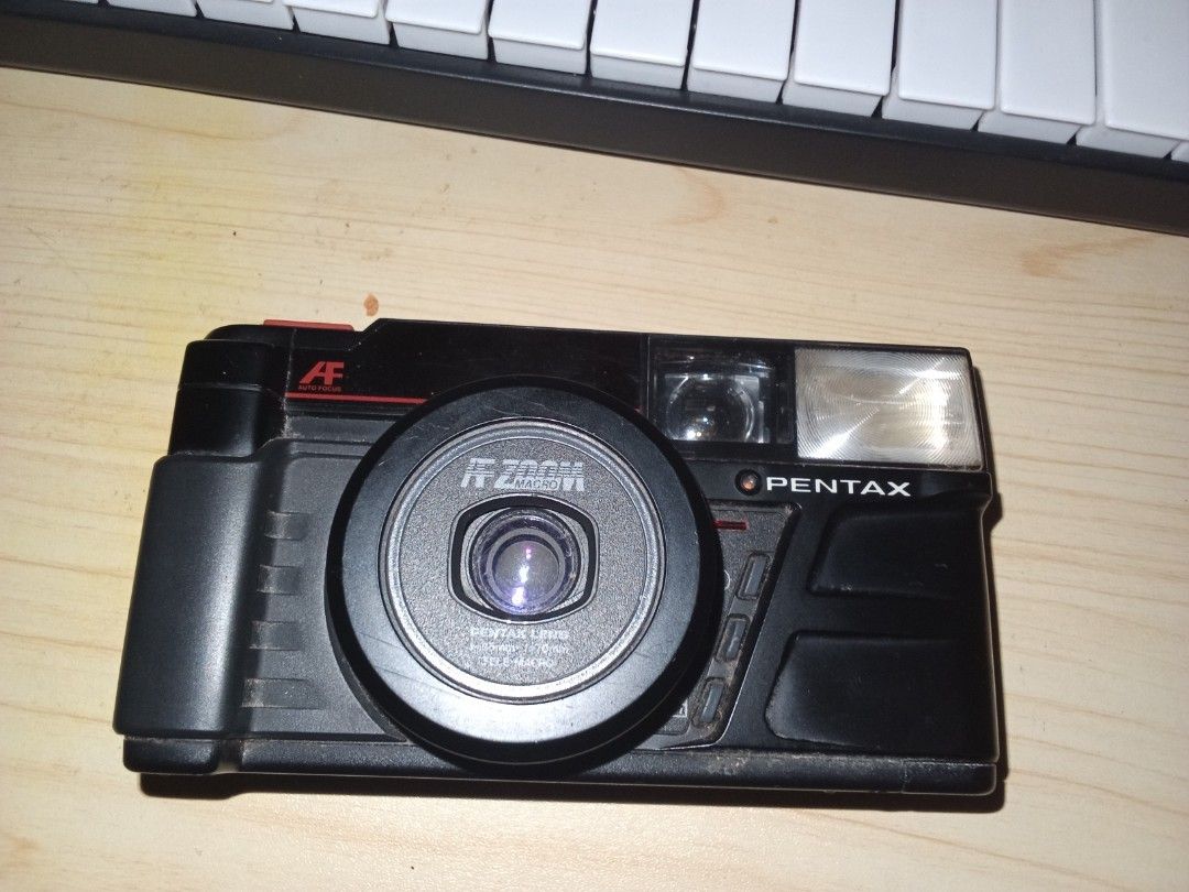 Pentax PC-300 QD 35mm Film Camera (Category: Cameras) located in Manila. Submitted by miyazakiyuu____ (Listing ID 1460477525, Image 1). Description: - Pentax PC-300 QD 35mm film camera - Autofocus and built-in flash - Easy to use, great for casual shooting - Tested and working condition - Some dust and minor scuffs on body, does not affect performance - No Film included rfs. need school funds .