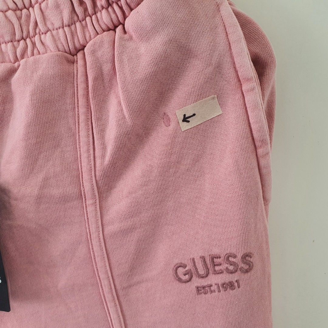 Pink Guess Est. 1981 Sweatpants (Category: Babies & Kids Fashion) located in Tarlac. Submitted by resaleclub (Listing ID 1460467543, Image 3). Description: - Pink Guess sweatpants - Embroidered logo detail - Comfortable elastic waistband with drawstring - Ideal for everyday casual wear - please check photos for stain, discoloration, pinhole or mending. Bawal po sa maselan.