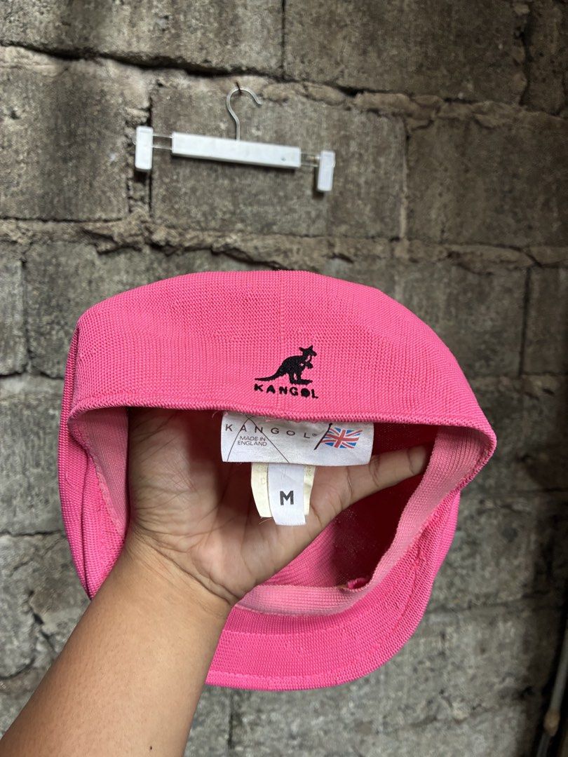 Pink Kangol Flat Cap Hat Size M (Category: Caps & Hats) located in Manila. Submitted by assortedgoodsv3 (Listing ID 1460458200, Image 2). Description: - Classic pink Kangol flat cap - Iconic embroidered kangaroo logo on the side - Made in England - Size: Medium (M) - Perfect for adding a pop of color to your look - Please check photos for detailed condition.