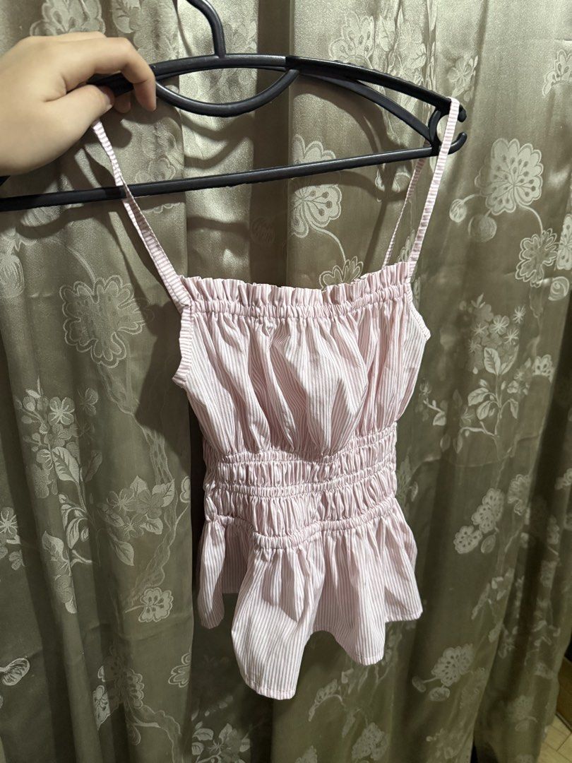 Pink Striped Smocked Camisole Top (Category: Sleeveless) located in Mabalacat. Submitted by ilovegyu (Listing ID 1460309206, Image 1). Description: - Cute pink camisole top - White stripes - Smocked bodice - Ruffled hem - worn once.