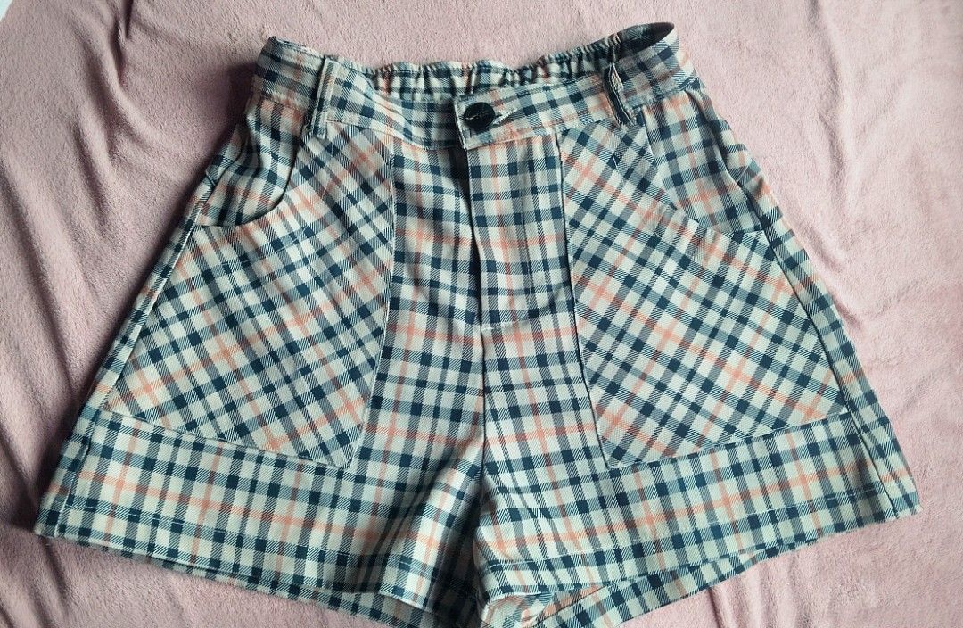 Plaid High-Waisted Shorts with Pockets (Category: Shorts) located in Manila. Submitted by wisefox.brambram (Listing ID 1460369334, Image 1). Description: - Cute plaid shorts - High-waisted with elastic waistband - Two front pockets - Navy, cream, and coral color palette - Ideal for casual wear.