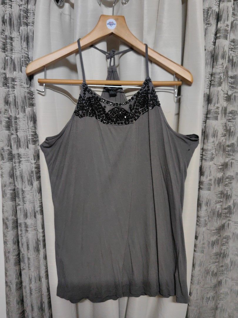 Plus Size Y2K beaded Sequin Gray Top (Category: Sleeveless) located in Taguig. Submitted by chielatte (Listing ID 1460362379, Image 1). Description: gray sleeveless tank top featuring dark beaded and sequined embellishments along the high neckline and thin racerback-style shoulder straps. with pinhole see all picture 00130 B42xL28.