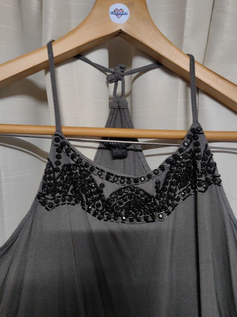 Plus Size Y2K beaded Sequin Gray Top (Category: Sleeveless) located in Taguig. Submitted by chielatte (Listing ID 1460362379, Image 2). Description: gray sleeveless tank top featuring dark beaded and sequined embellishments along the high neckline and thin racerback-style shoulder straps. with pinhole see all picture 00130 B42xL28.