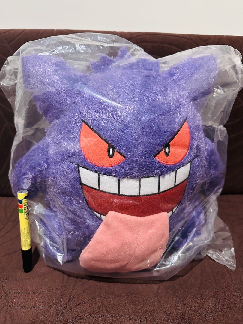 Pokemon Gengar Plush (Category: Plushies & Soft Toys) located in Quezon City. Submitted by mikemofu (Listing ID 1460424576, Image 1). Description: - Large Gengar plush toy - Brand new, still in original plastic packaging - Official Banpresto item - Tag indicates 'Pokemon Type: Ghost' - Ideal gift for any Pokemon enthusiast - Approximate size: [insert size here if known] - Bandai.