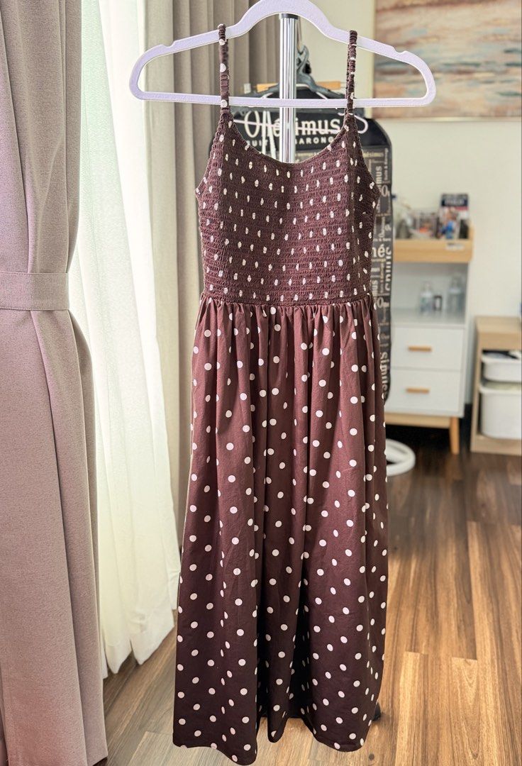 Polka Dot Smocked Maxi Dress (Category: Dresses) located in Santa Rosa. Submitted by rainscloset29 (Listing ID 1460392333, Image 1). Description: Size M • Worn twice only • Brown/mauve with cream polka dot print • Smocked fitted bodice • Flowy maxi-length • Feminine and flattering silhouette • Very good condition • No stains, holes, or major flaws • Selling as part of my decluttering 📍 Sta. Rosa, Laguna 🚚 Shipping available at buyer’s expense.