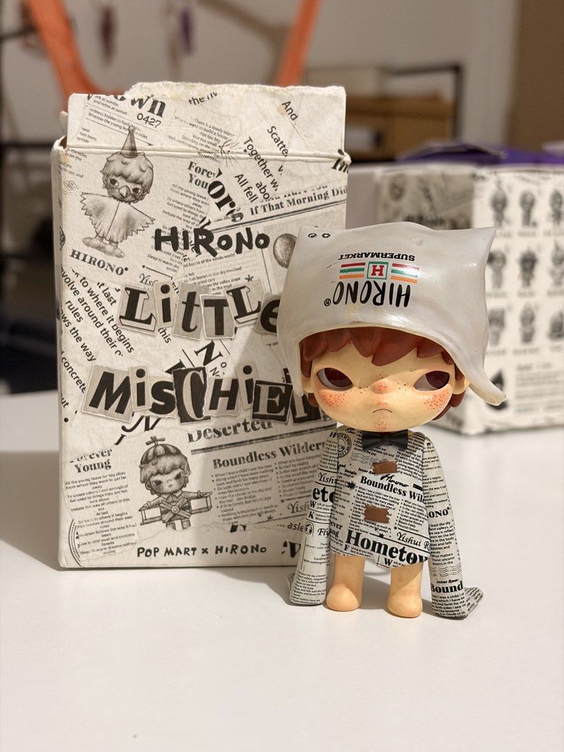 POP MART HIRONO Little Mischief (Category: Designer & Blind Box Toys) located in Manila. Submitted by aubreyours07 (Listing ID 1460479982, Image 1). Description: - HIRONO Little Mischief - From the "Deserted" series - Unique newspaper print clothing - Supermarket-themed hat accessory - Comes with original box - Ideal for collectors.
