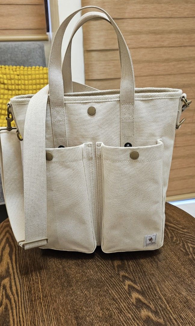 Porter International Canvas Tote Bag (Category: Tote Bags) located in Navotas City. Submitted by walburst (Listing ID 1460275425, Image 1). Description: Porter International Tote Three-way design Thick and durable woven Duck canvas Cream Excellent condition Complete with sling strap and base shaper *minor stains *wear on swivel clasp and D ring paint coating retails @ Php 18,000.00.