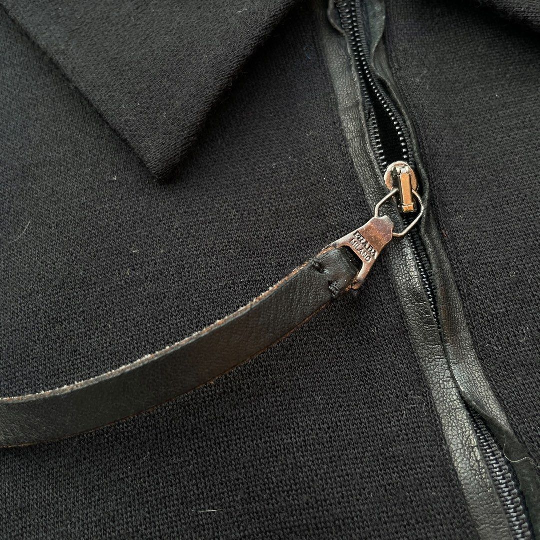 Prada - Vintage Quarter-zip Wool Pullover with Leather Lining Slim (Category: Coats, Jackets and Outerwear) located in Los Banos. Submitted by declutterking (Listing ID 1460470954, Image 3). Description: Size XL on tag • leather-lined zipper • engraved zipper • quarter zip design • 45% virgin wool | 45% acrylic • sizing is kind of small, please check measurements before sending an offer Dimensions: 17.25" shoulders 20" chest 28" length 26.5" slee