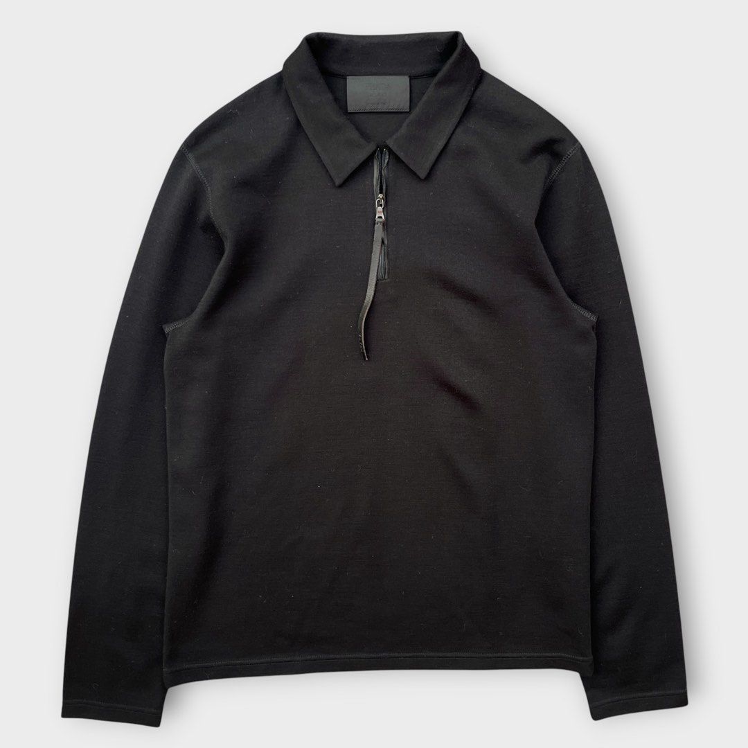 Prada - Vintage Quarter-zip Wool Pullover with Leather Lining Slim (Category: Coats, Jackets and Outerwear) located in Los Banos. Submitted by declutterking (Listing ID 1460470954, Image 1). Description: Size XL on tag • leather-lined zipper • engraved zipper • quarter zip design • 45% virgin wool | 45% acrylic • sizing is kind of small, please check measurements before sending an offer Dimensions: 17.25" shoulders 20" chest 28" length 26.5" slee
