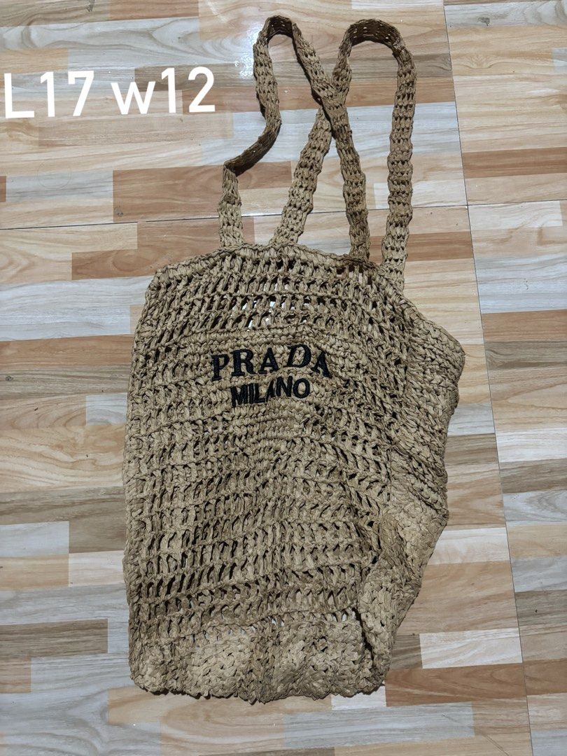 Prada Milano (Category: Luxury Bags & Wallets) located in Tubigon. Submitted by wawiesunbe75372 (Listing ID 1460445414, Image 1). Description: - Woven tote bag with authentic Prada Milano logo - Natural straw color - Unique open-knit design - Woven handles - Ideal for beach days and casual outings - Spacious for essentials.