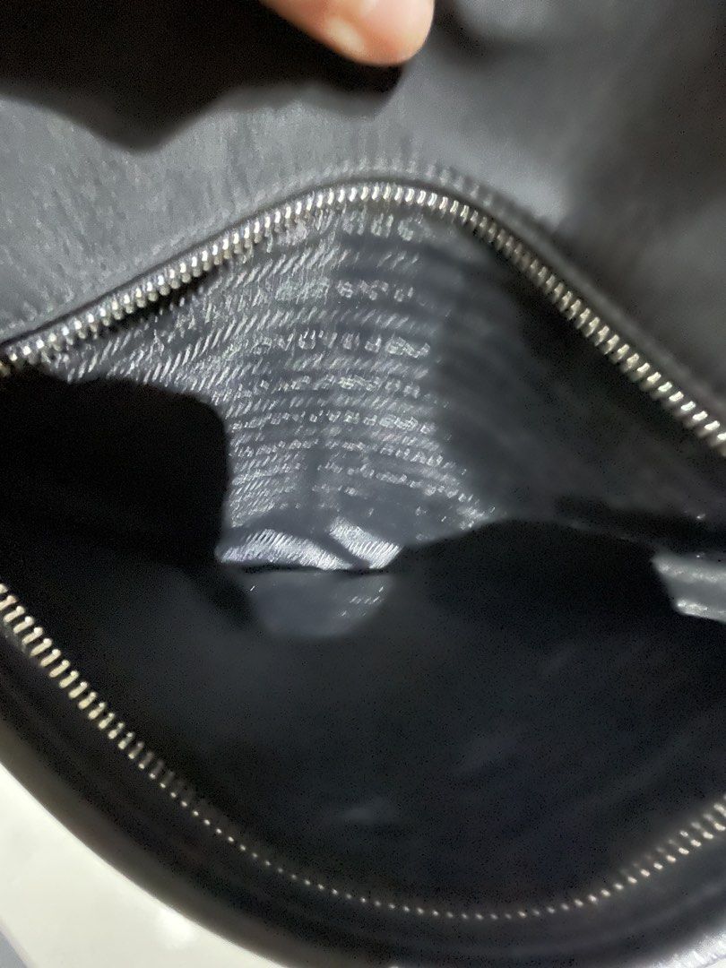 Prada Nylon Crossbody Bag Black (Category: Luxury Bags & Wallets) located in Makati City. Submitted by GoddessCloset (Listing ID 1460490206, Image 3). Description: - Material: Durable Nylon with Leather Trim - Adjustable Strap with Iconic Prada Logo - Secure Zippered Main Compartment - Convenient Front Pocket - Multiple Interior Compartments for Organization - Ideal for Everyday Use.