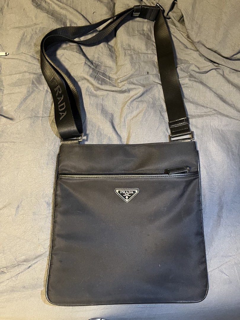 Prada Nylon Crossbody Bag Black (Category: Luxury Bags & Wallets) located in Makati City. Submitted by GoddessCloset (Listing ID 1460490206, Image 1). Description: - Material: Durable Nylon with Leather Trim - Adjustable Strap with Iconic Prada Logo - Secure Zippered Main Compartment - Convenient Front Pocket - Multiple Interior Compartments for Organization - Ideal for Everyday Use.