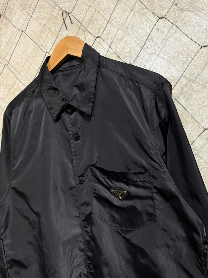 Prada Re-nylon Black Button Longsleeve: (Category: Tshirts & Polo Shirts ) located in Manila. Submitted by ardobe.mnl (Listing ID 1460485410, Image 3). Description: Size: Large Dimes: 21x28 Condition: Good asnew Flaw: None! Dm for inquiries! 🛒📥.