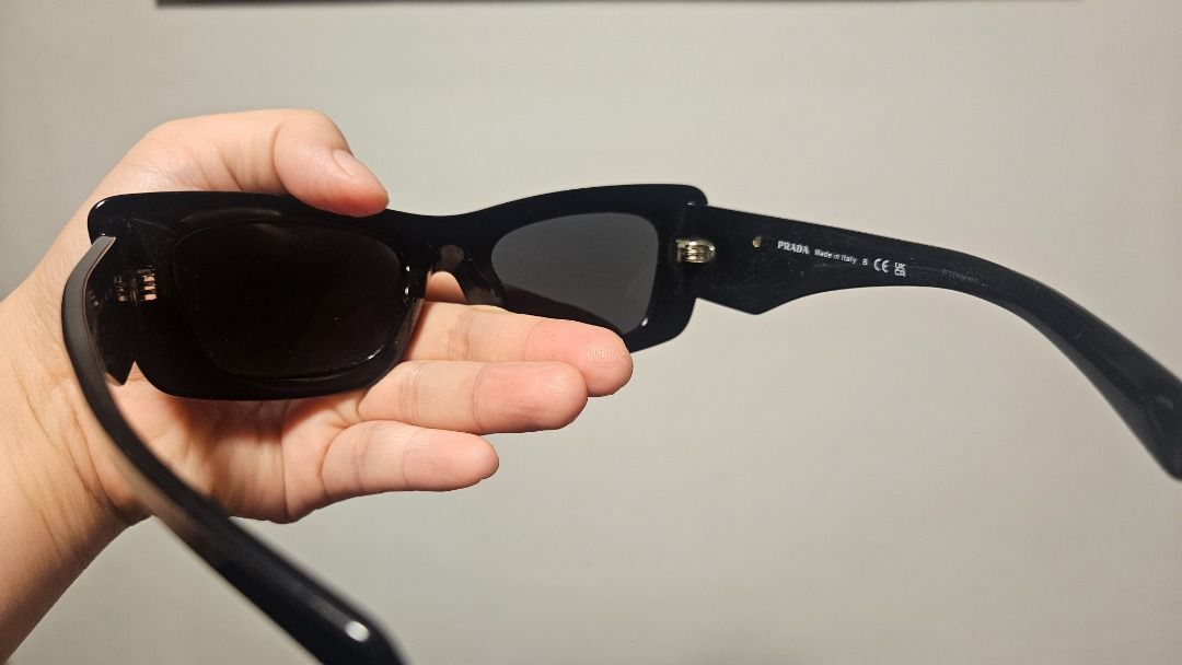 Prada Sunglasses Black Square Frame (Category: Sunglasses & Eyewear) located in Las Pinas. Submitted by danesalvy (Listing ID 1460467672, Image 3). Description: - Authentic Prada sunglasses - Bought from Sunglasses Hut store in Newport Mall - Classic black square frame - Iconic Prada triangle logo detail on the side - Comes with original Prada box - Ideal for sunny weather.