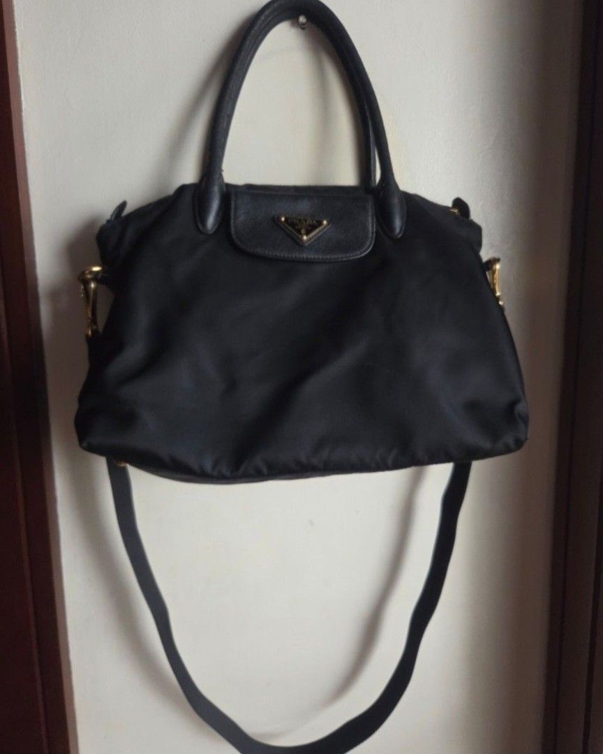 Prada Tessuto Saffian Nero convertible handbag (Category: Luxury Bags & Wallets) located in Quezon City. Submitted by stuffiesetc (Listing ID 1460426505, Image 2). Description: Prada BN2541 Tessuto Saffian Nero convertible handbag guaranteed authentic. bought in a prada store in italy for about Php58,000+. was used as an everyday bag but still in good condition. no holes,tear or stains. just minor signs of handling and use such as scuffs of the h