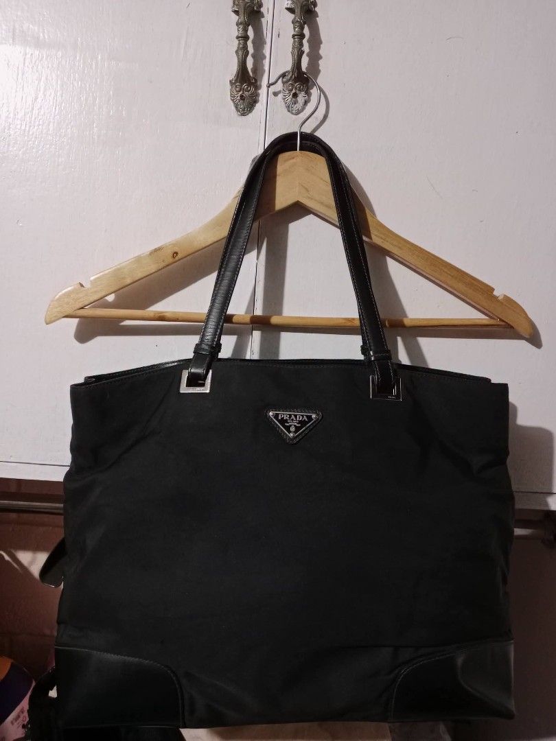 Prada tote nylon (Category: Shoulder Bags) located in Angeles City. Submitted by mjshoppingretail (Listing ID 1460424092, Image 1). Description: excellent used small niddle hole lang harap banda baba part no noticable black na black pato and.