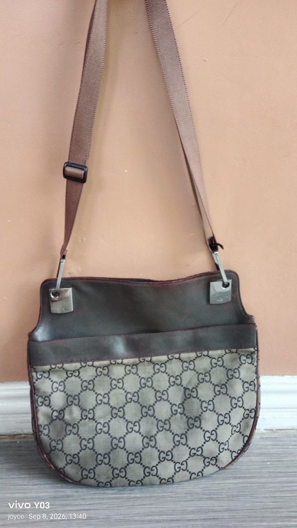 Preloved authentic Gucci Monogram Shoulder Bag (Category: Cross-body Bags) located in Cabuyao City. Submitted by selections888 (Listing ID 1460398852, Image 2). Description: - Authentic Gucci shoulder bag)sing - Classic GG monogram canvas with leather trim - Adjustable strap for comfortable wear - Silver hardware with Gucci logo - made in Italy -with serial /code -medium size - Shows some signs of wear on leather trim and hardware -expect signs o