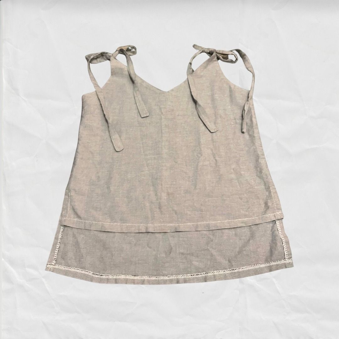 Pretty Gray Ribbon Top (Category: Sleeveless) located in Tuguegarao City. Submitted by declutterwithfran (Listing ID 1460479553, Image 2). Description: Fits S-M - super pretty esp for going out MOD: JNT (fees are shouldered by the buyer) MOP: MariBank/ Gcash / Bank Transfer.