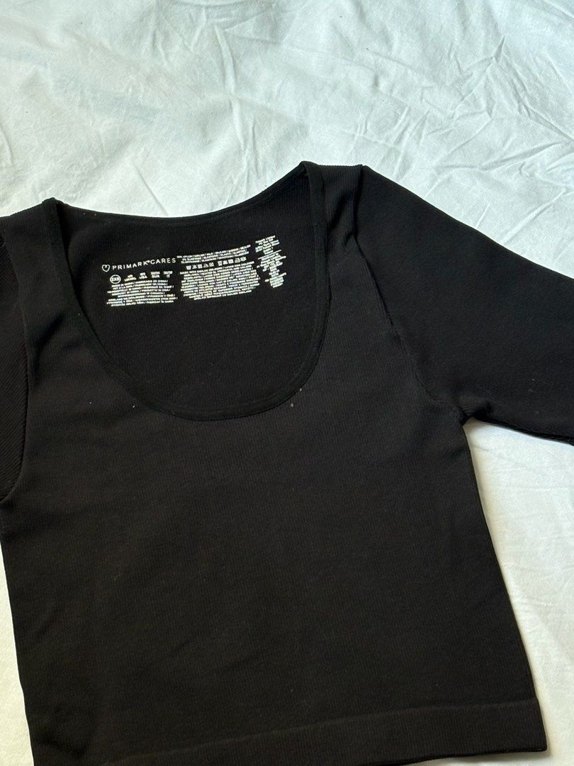 Primark Cares Black Square Neck Ribbed Crop Top (Category: Sleeveless) located in Pasay City. Submitted by nicoletlntn_ (Listing ID 1460481766, Image 2). Description: - Black crop top from Primark - Square neckline - Short sleeves - Ribbed texture - Comfortable and stretchy material - Versatile for layering or wearing on its own - Easy to pair with jeans or skirts.