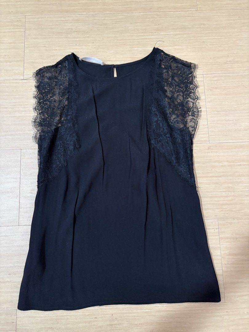 Promod Black Lace Sleeve Top (Category: Blouses) located in Taguig. Submitted by secondhandstuffhere (Listing ID 1460314978, Image 1). Description: - Sleeveless black top - Features delicate lace detailing on sleeves - Lace has a beautiful scalloped edge - Small keyhole opening at the back with button closure - Fabric drapes nicely for a flattering fit - Versatile piece: dress it up or down.