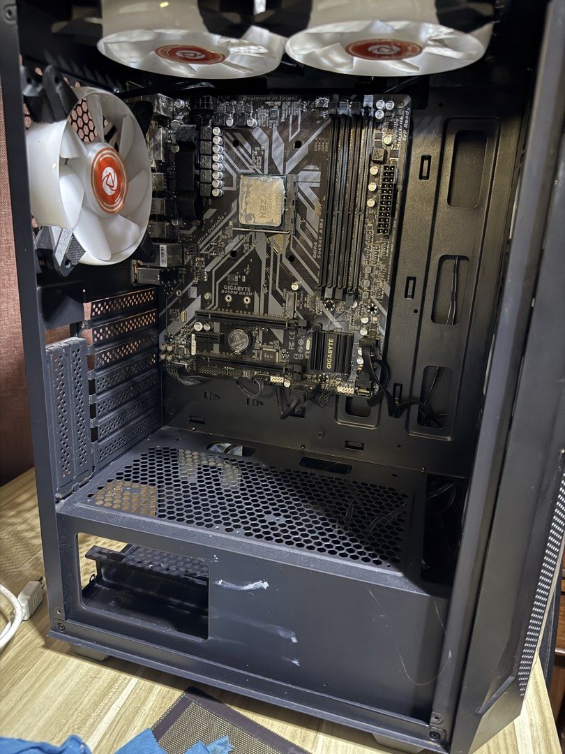 PSU Keytech PC Case, Fan, Mobo (Category: Computer Parts) located in Cavite. Submitted by matcha_00 (Listing ID 1460496731, Image 1). Description: will sold as bundle PC Case walang tempered glass na cover nabasag kasi wala naman syang gasgas much may cover pa yung unahan na glass Mobo (defective) and fan (defective)still intact ryzen 5-4500 processor also kasama na (defective ) AMD Fan still works PSU ygt 750 still works.