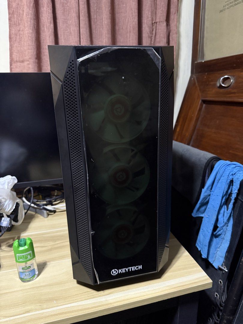 PSU Keytech PC Case, Fan, Mobo (Category: Computer Parts) located in Cavite. Submitted by matcha_00 (Listing ID 1460496731, Image 2). Description: will sold as bundle PC Case walang tempered glass na cover nabasag kasi wala naman syang gasgas much may cover pa yung unahan na glass Mobo (defective) and fan (defective)still intact ryzen 5-4500 processor also kasama na (defective ) AMD Fan still works PSU ygt 750 still works.