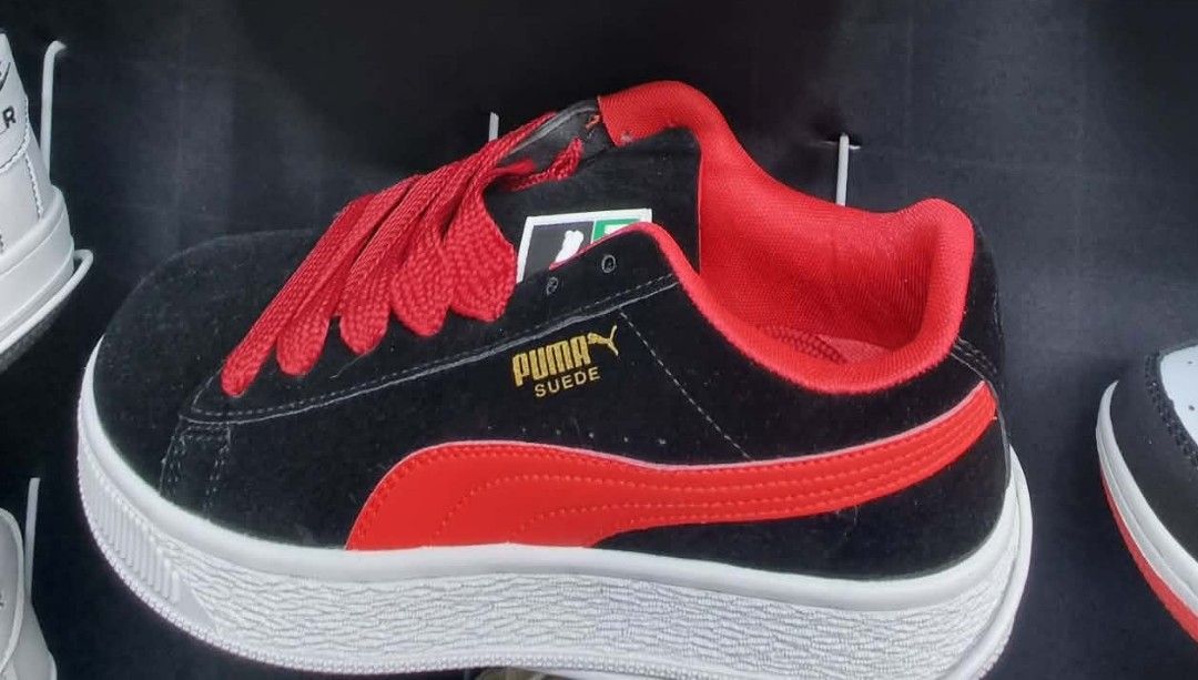 Puma Suede Classic Black Red Sneakers (Category: Sneakers) located in Marawi City. Submitted by izzypj (Listing ID 1460506164, Image 1). Description: - Classic Puma Suede sneakers - Black suede upper with red accents and laces - White sole - Perfect for casual wear.