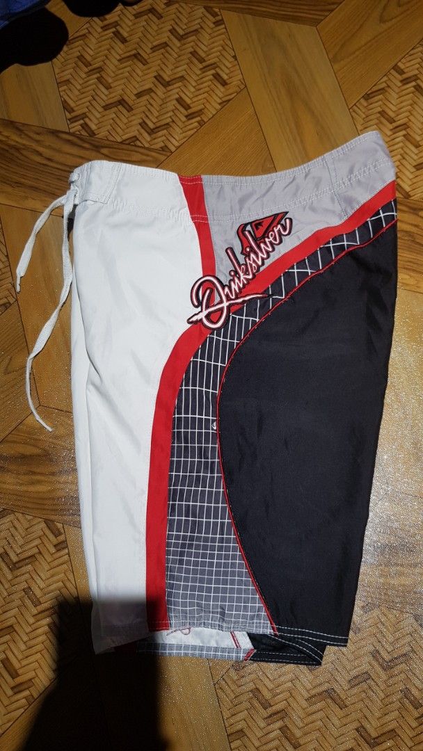 Quiksilver Board Shorts White Red Black Grid Pattern (Category: Swim Trunks & Board Shorts) located in Manila. Submitted by nice430 (Listing ID 1460319968, Image 3). Description: - Quiksilver board shorts - White with red and black grid accents on the sides - Drawstring waist for adjustable fit - Perfect for swimming, surfing, or lounging - In good, pre-loved condition.
