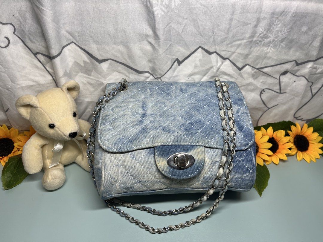 Quilted Denim Shoulder Bag with Chain Strap (Category: Shoulder Bags) located in Liloan. Submitted by sakurumifinds2809 (Listing ID 1460352897, Image 1). Description: - Cute quilted denim shoulder bag - Unique tie-dye wash - Stylish silver chain strap - Secure twist-lock closure - Ideal for casual outings.
