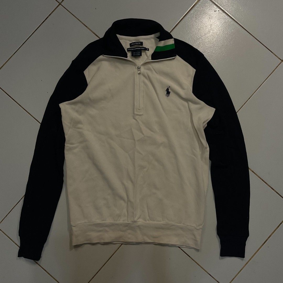 Ralph Lauren Half Zip Sweatshirt Cream Navy (Category: Coats, Jackets and Outerwear) located in Morong. Submitted by rusty.vault (Listing ID 1460412370, Image 1). Description: - Cream and navy Ralph Lauren sweatshirt - Half zip neckline with a collar - Classic polo player logo embroidered on the chest - Ribbed cuffs and hem for a comfortable fit - Ideal for casual wear and layering.