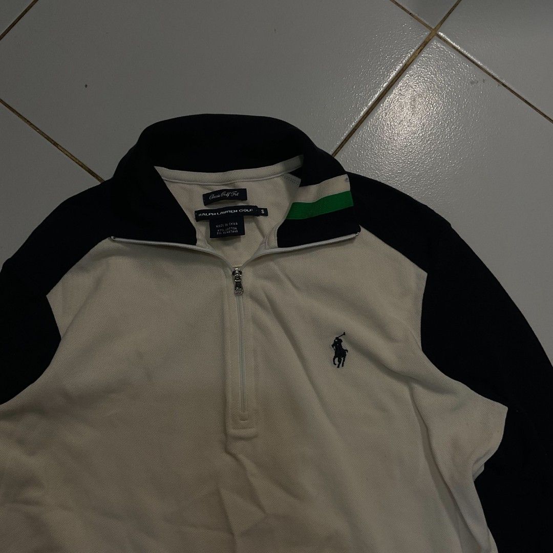 Ralph Lauren Half Zip Sweatshirt Cream Navy (Category: Coats, Jackets and Outerwear) located in Morong. Submitted by rusty.vault (Listing ID 1460412370, Image 3). Description: - Cream and navy Ralph Lauren sweatshirt - Half zip neckline with a collar - Classic polo player logo embroidered on the chest - Ribbed cuffs and hem for a comfortable fit - Ideal for casual wear and layering.